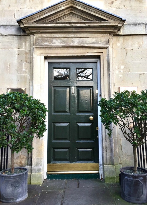 Door, architrave and carefully aligned trees, very elegant...